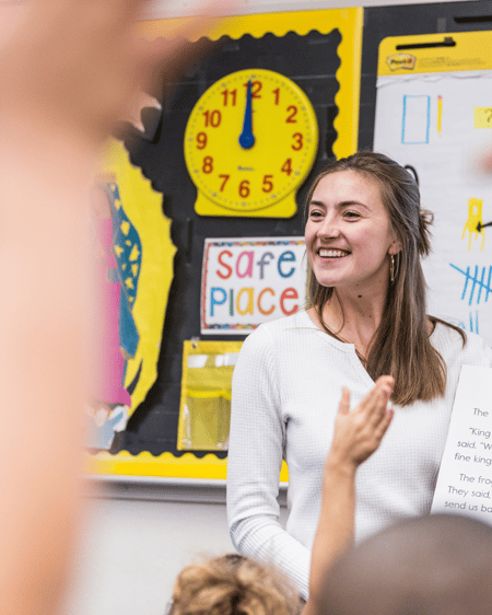 Former STF and current teacher joyfully leading a class
